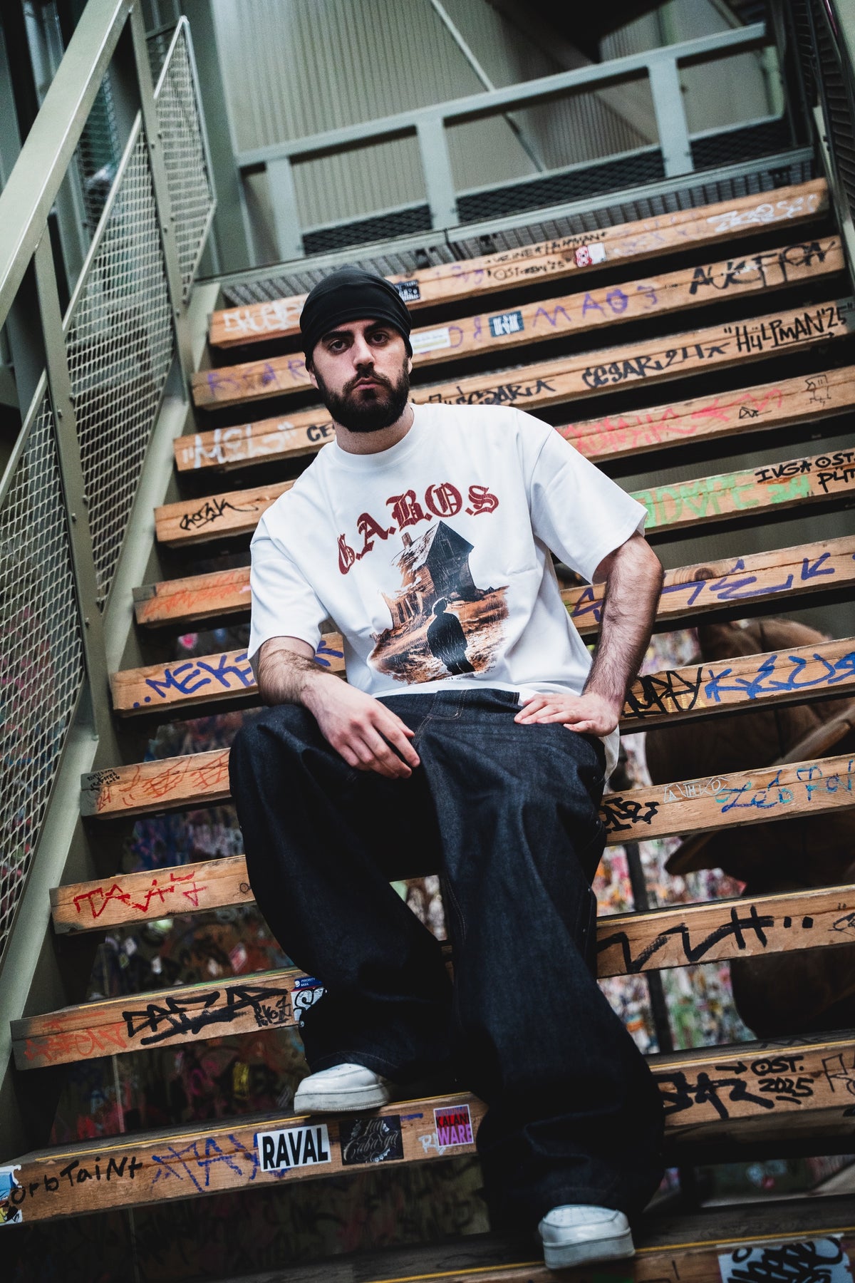 White GABOS T-shirt on graffiti stairs
