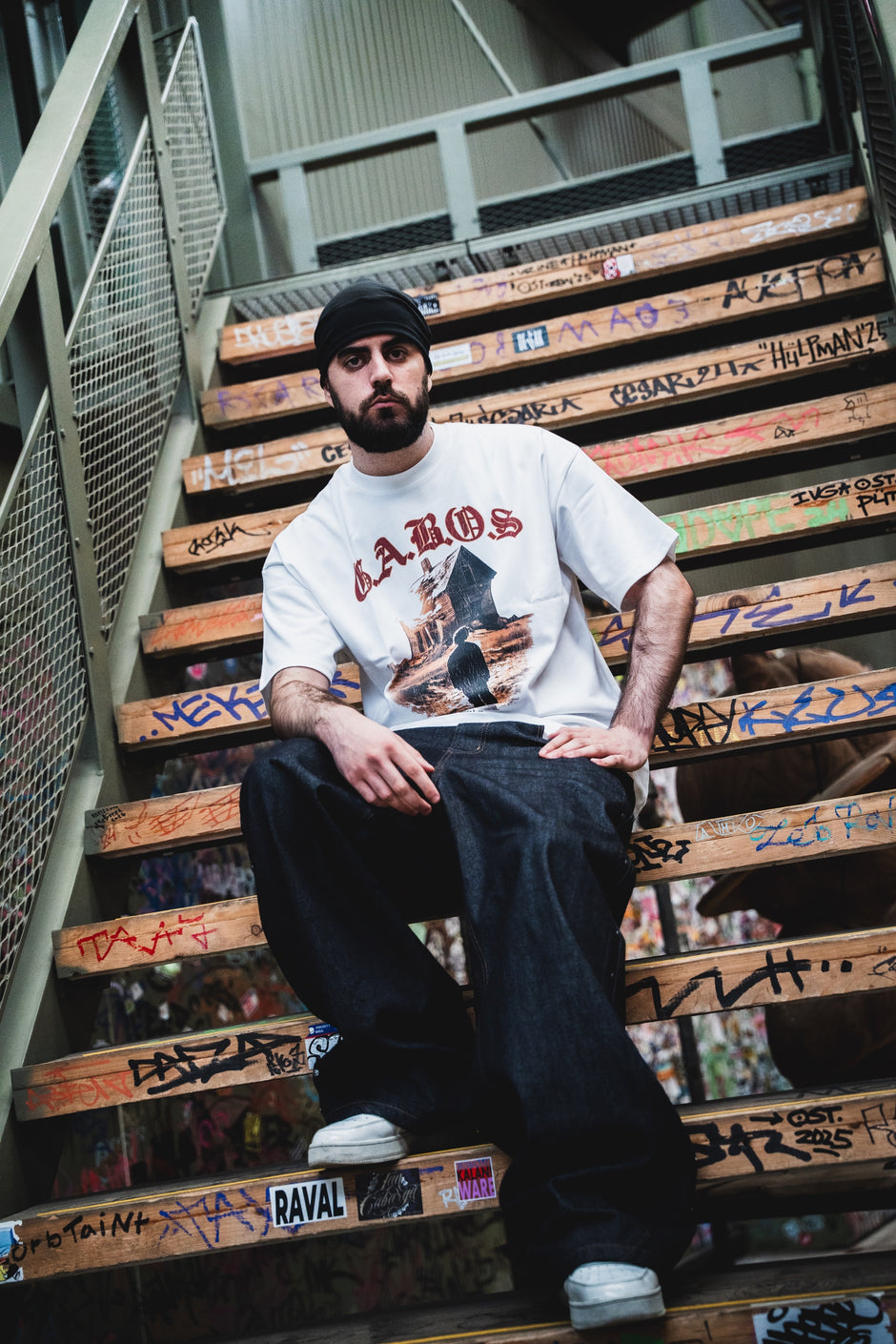 White GABOS T-shirt on graffiti stairs